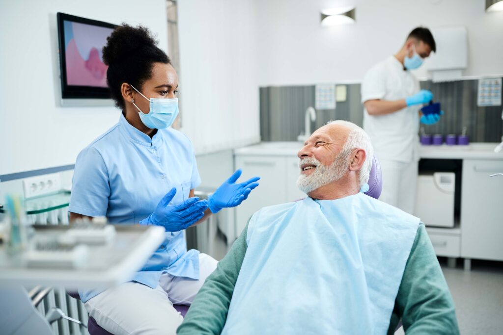 Adult patient talking to dentist during consultation