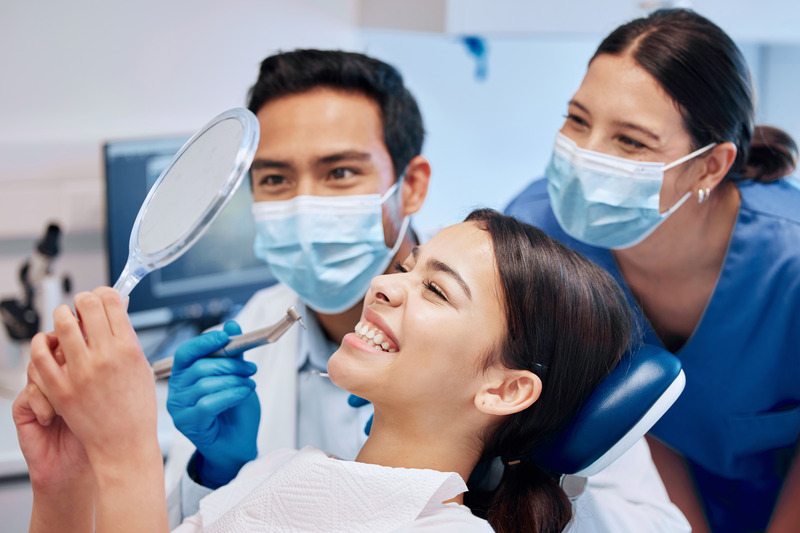 Patient at the dentist with a fixed chipped tooth